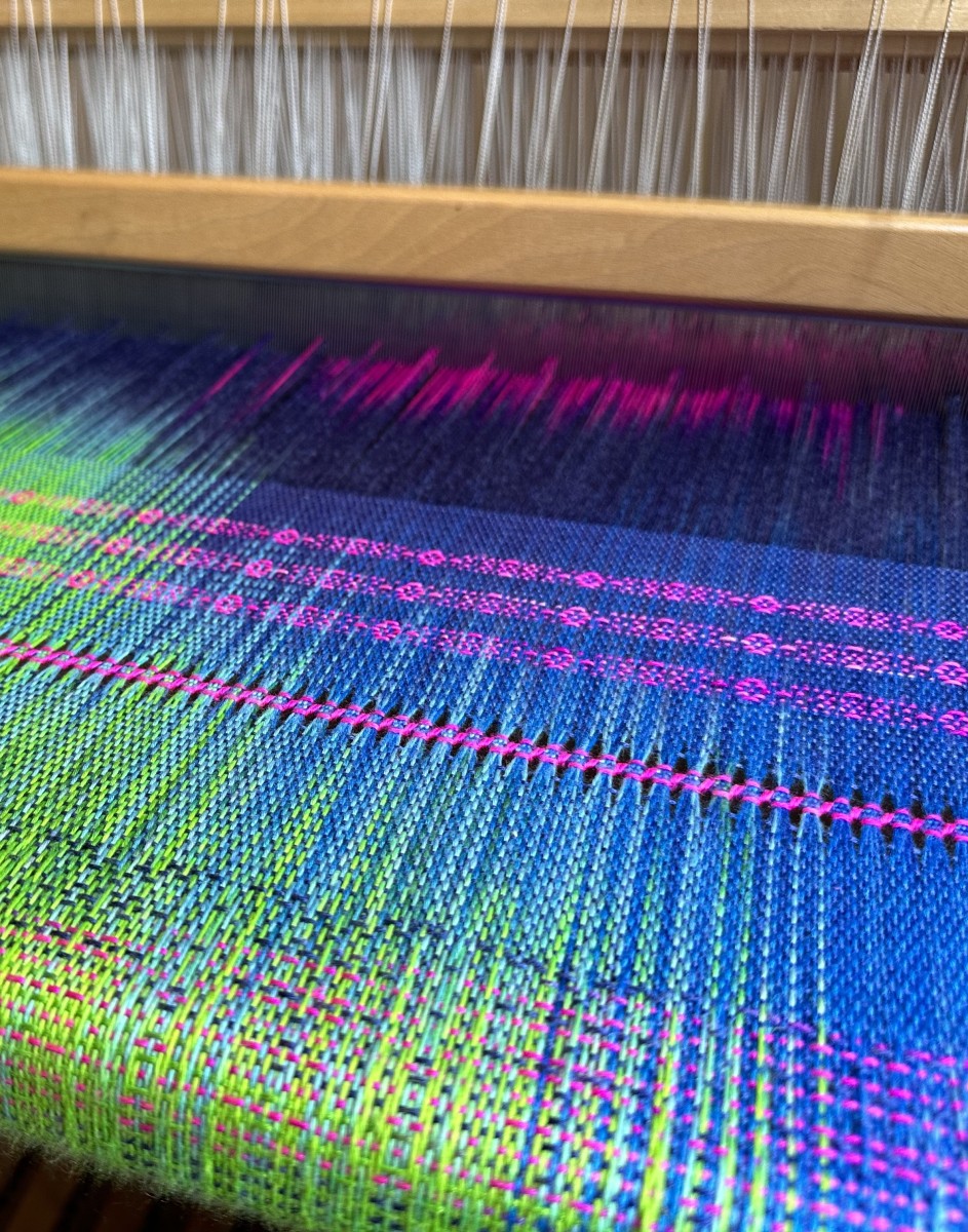 Weaving in progress on a shawl inspired by the Northern Lights