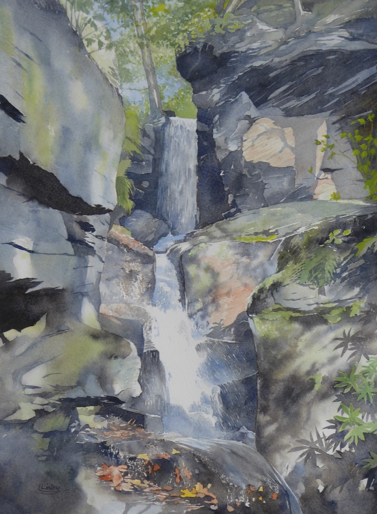 Waterfall in dappled light