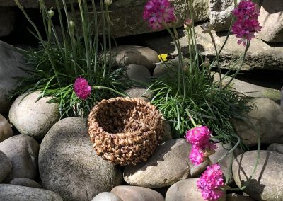 small round pot made from dandelions